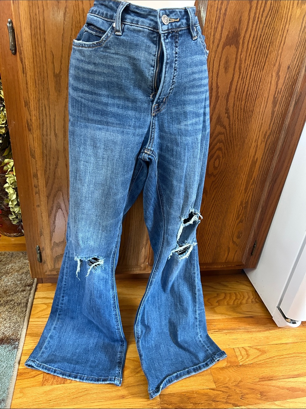 Distressed Blue Flare Jeans with Knee Rips